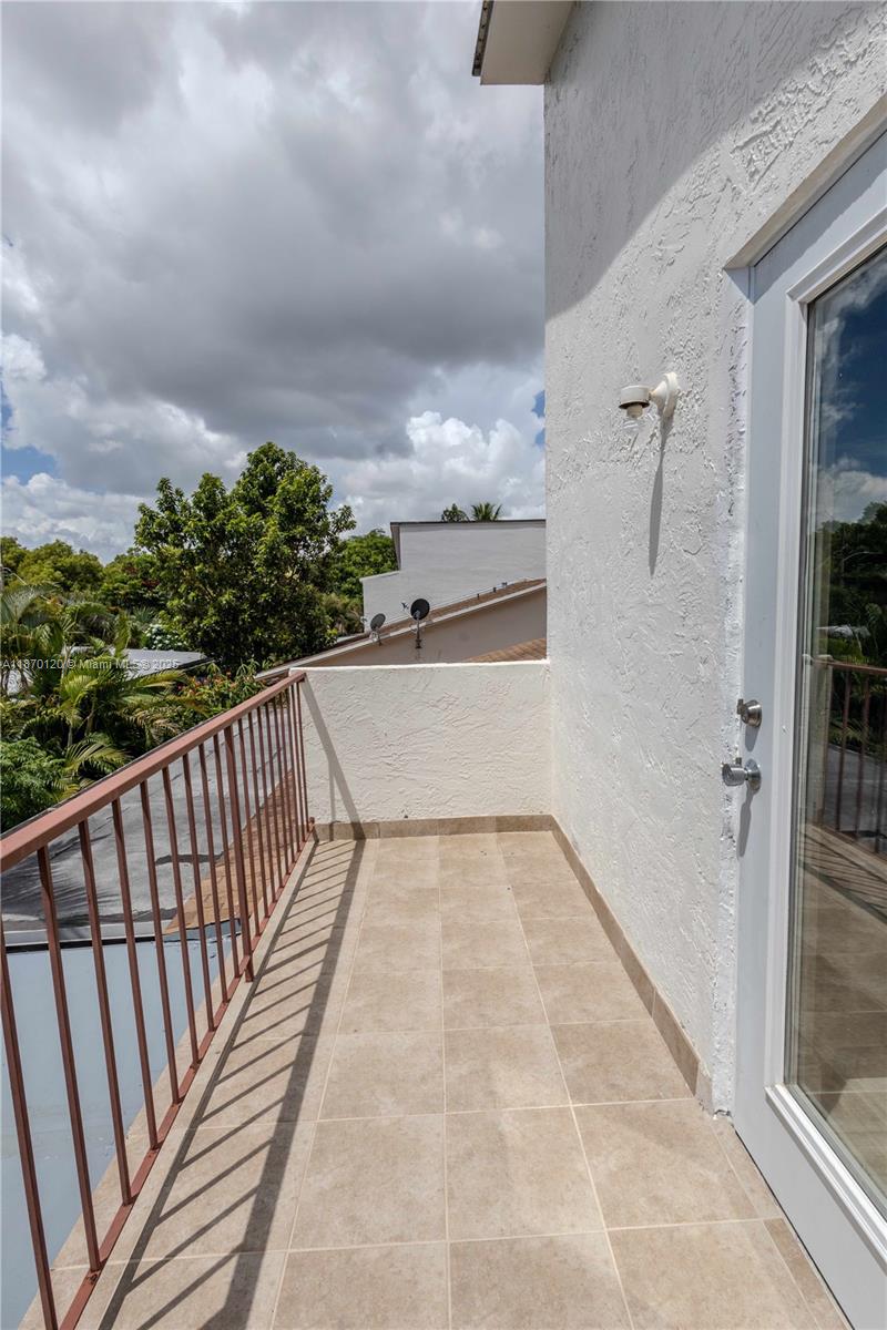 2435 Southwest 11th Street, Unit 9B Miami, FL 33135 - Photo 26 of 33 a view of balcony with wooden floor