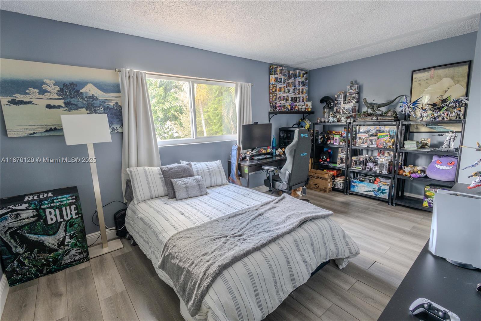 2435 Southwest 11th Street, Unit 9B Miami, FL 33135 - Photo 27 of 33 a bedroom with bed a dresser and a window