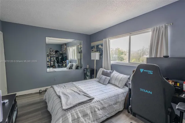a bedroom with bed and window