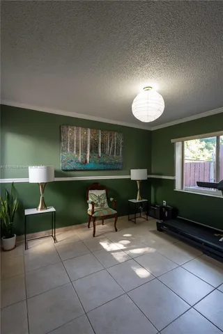a living room with furniture a window and a fireplace