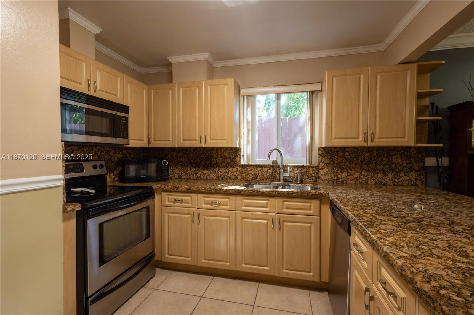 2435 Southwest 11th Street, Unit 9B Miami, FL 33135 - Photo 9 of 33 a kitchen with a sink stove and microwave