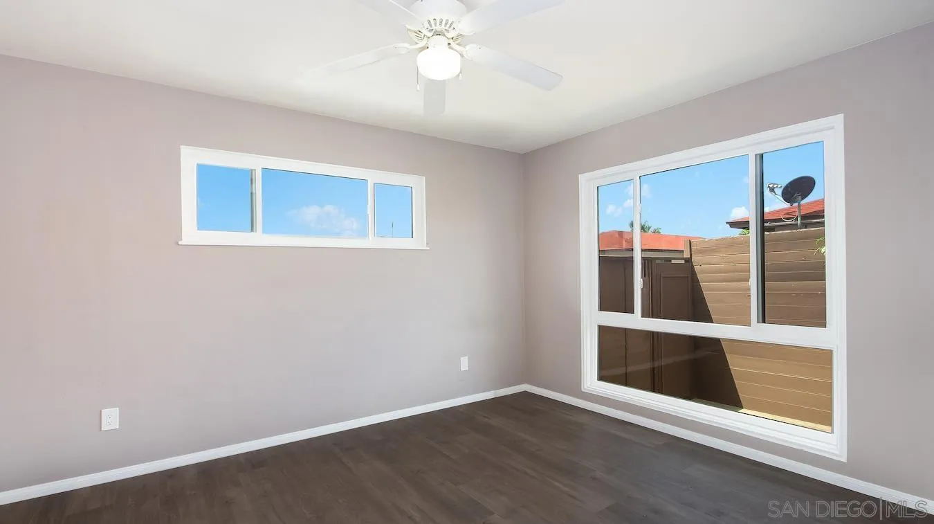 238 E Street Chula Vista, CA 91910 - Photo 11 of 15 an empty room with wooden floor and windows