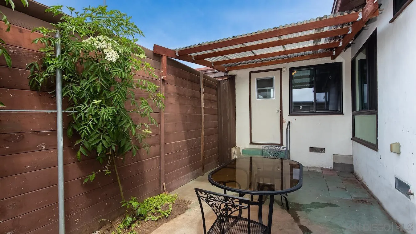 238 E Street Chula Vista, CA 91910 - Photo 14 of 15 a patio with table and chairs and potted plants