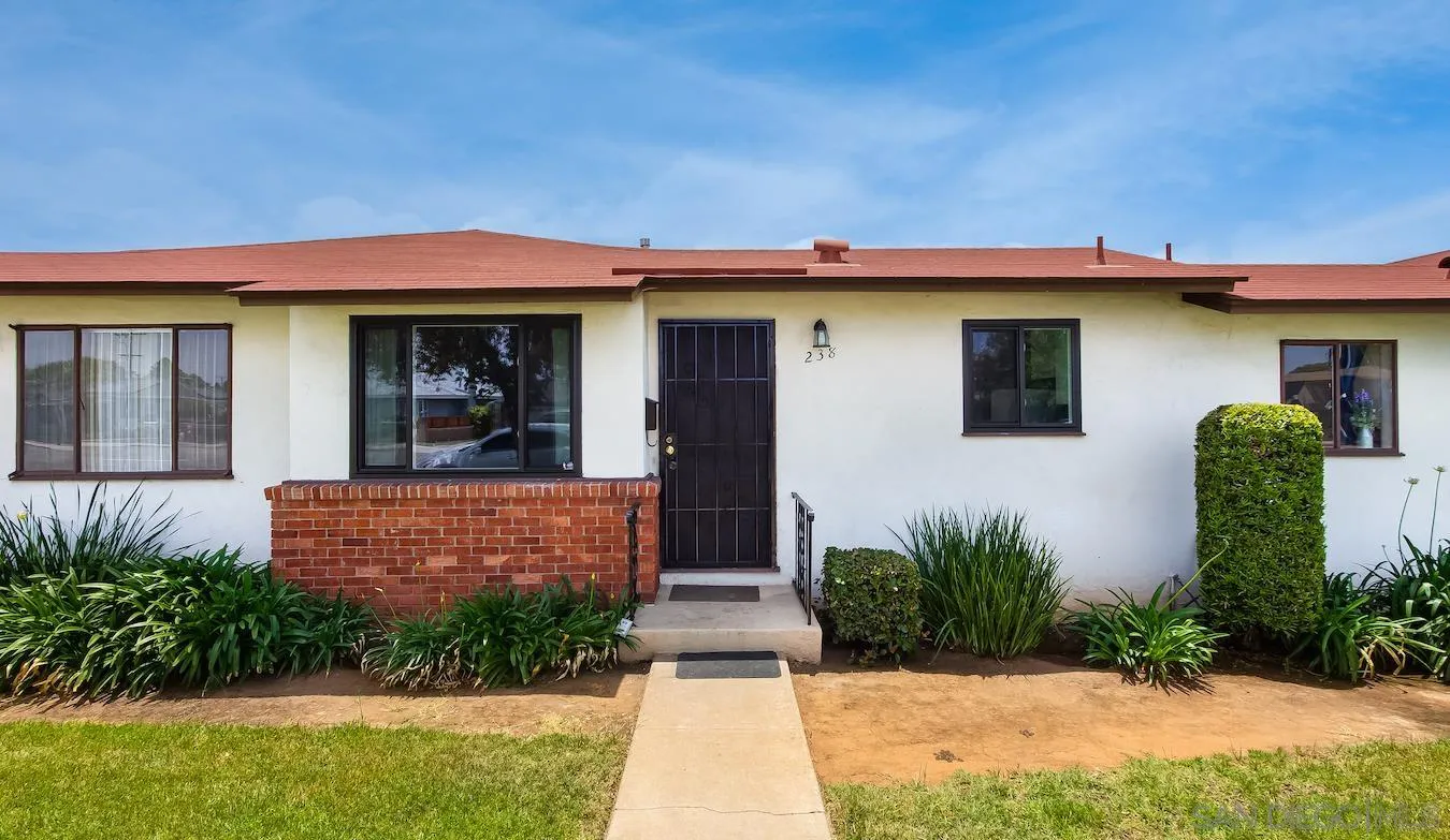 238 E Street Chula Vista, CA 91910 - Photo 2 of 15 a front view of a house with garden