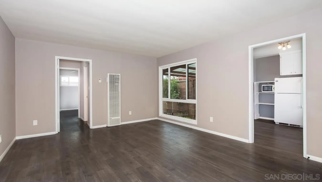 238 E Street Chula Vista, CA 91910 - Photo 8 of 15 an empty room with wooden floor & windows and bathroom