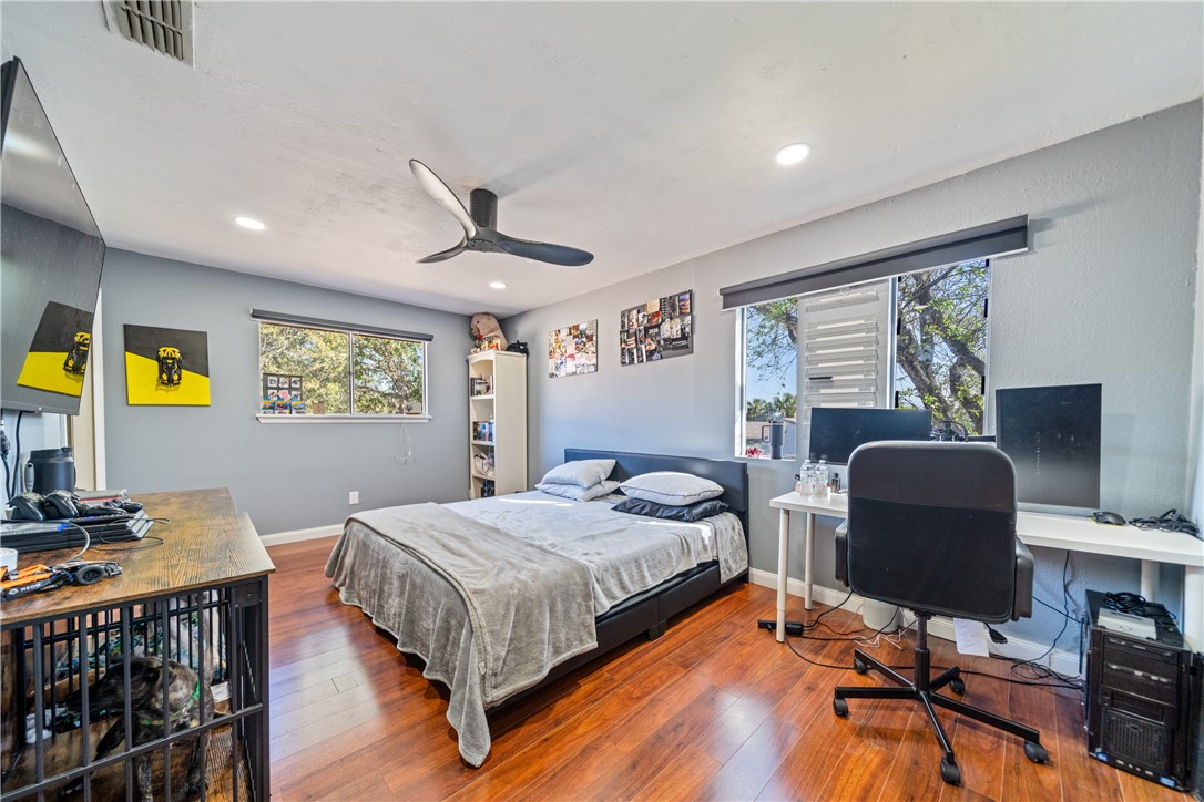 2217 Post Oak Drive Portland, TX 78374 - Photo 28 of 39 a bedroom with a bed and a desk