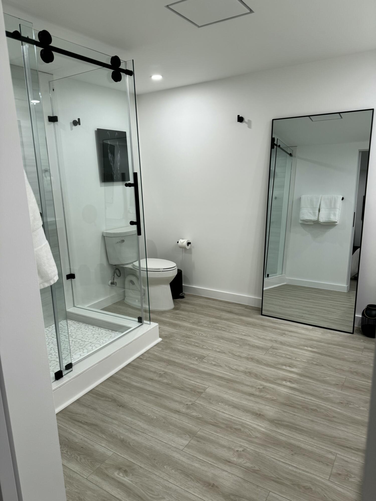 13400 Polo Road West Wellington, FL 33414 - Photo 13 of 16 a view of a hallway with wooden floor and glass door