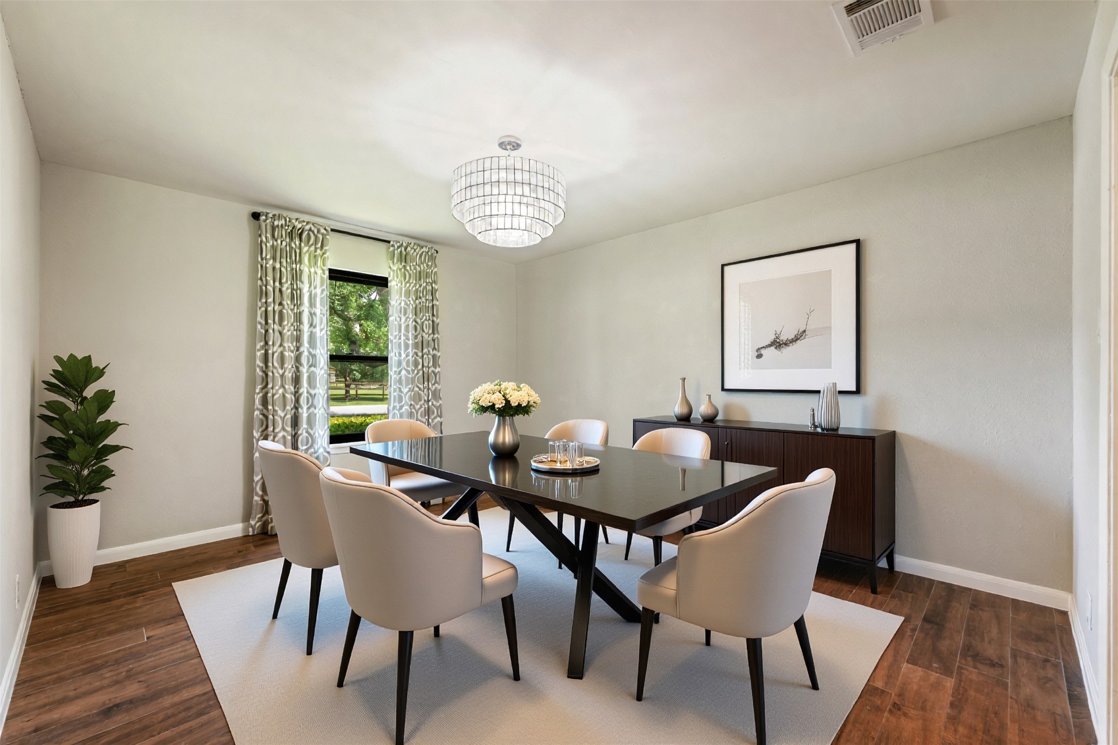 1600 Pin Oak Lane Round Rock, TX 78681 - Photo 8 of 40 Dining area featuring wood-finish flooring, a contemporary chandelier, and a large window with patterned drapes