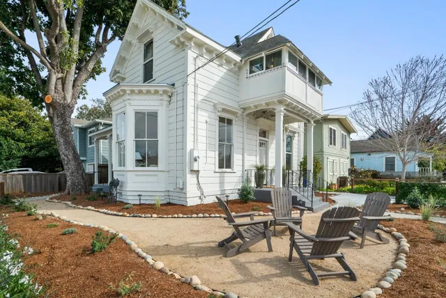 a view of a building with a bench in the patio
