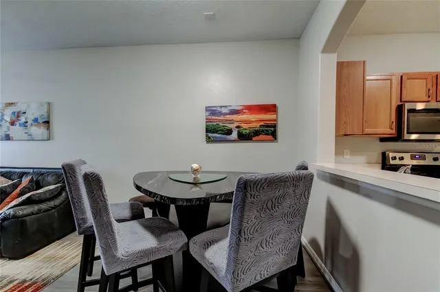 a kitchen with stainless steel appliances a refrigerator stove microwave and sink