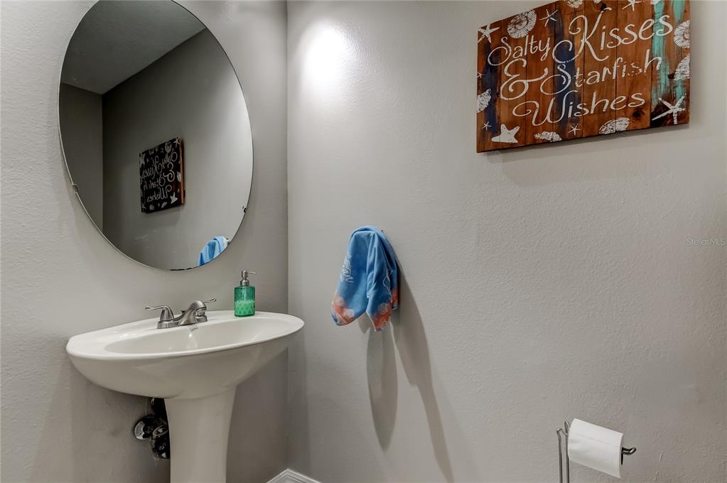 1138 Hillhurst Drive Wesley Chapel, FL 33543 - Photo 12 of 65 a bathroom with a sink and a mirror