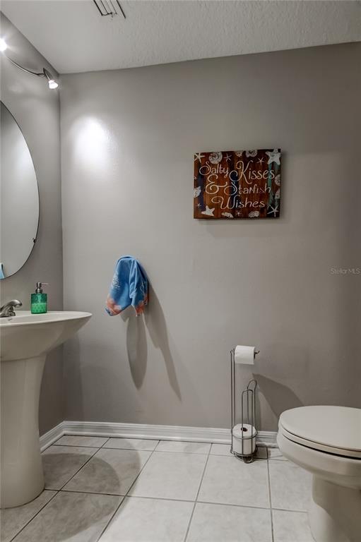 1138 Hillhurst Drive Wesley Chapel, FL 33543 - Photo 13 of 65 a bathroom with a toilet