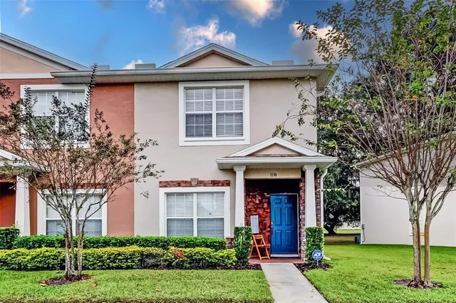 a view of a kitchen with a sink and chandelier