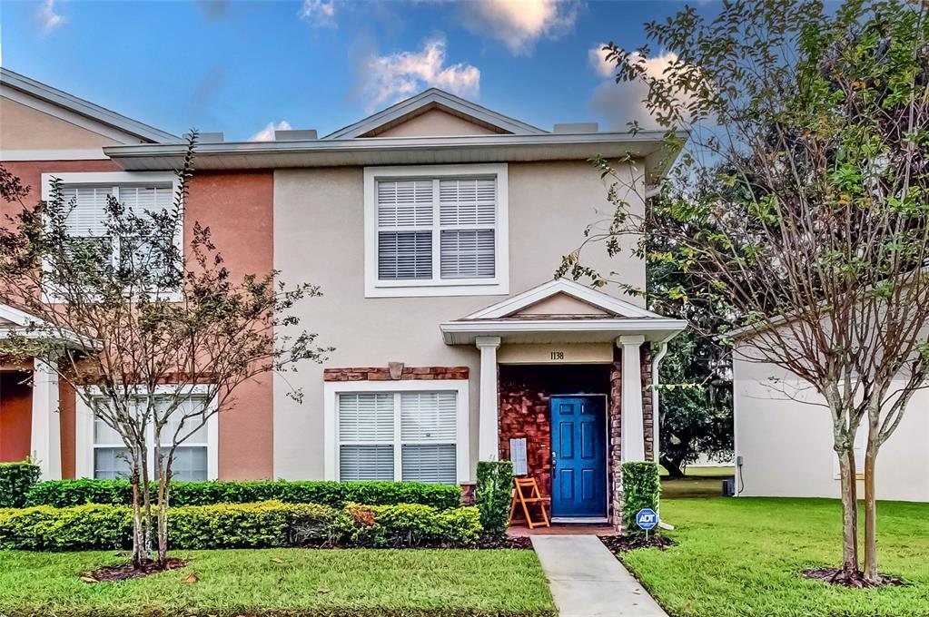 1138 Hillhurst Drive Wesley Chapel, FL 33543 - Photo 18 of 65 a front view of a house with garden