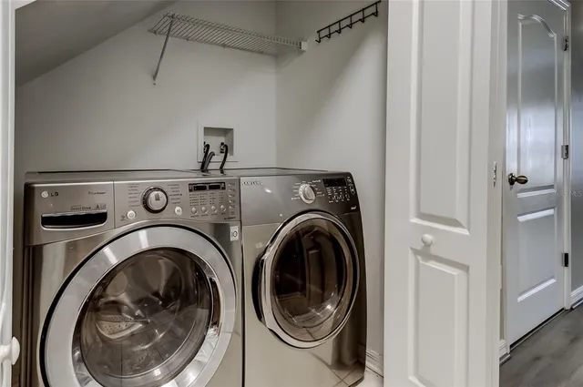 a bedroom with a bed and wall painting