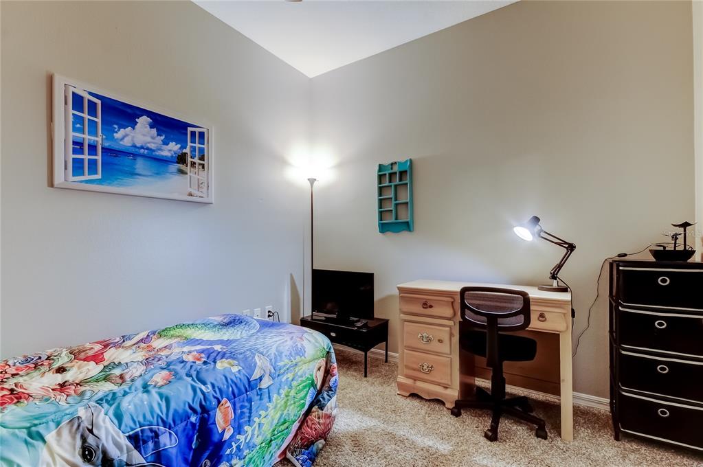 1138 Hillhurst Drive Wesley Chapel, FL 33543 - Photo 31 of 65 a bedroom with a bed and a closet