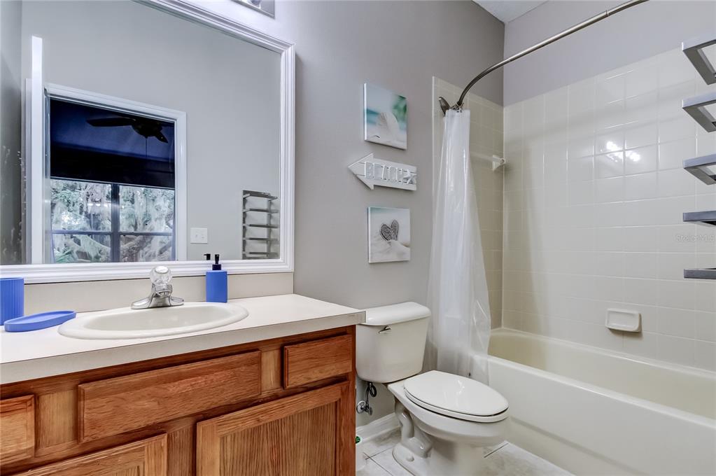 1138 Hillhurst Drive Wesley Chapel, FL 33543 - Photo 37 of 65 a bathroom with a sink toilet vanity and shower
