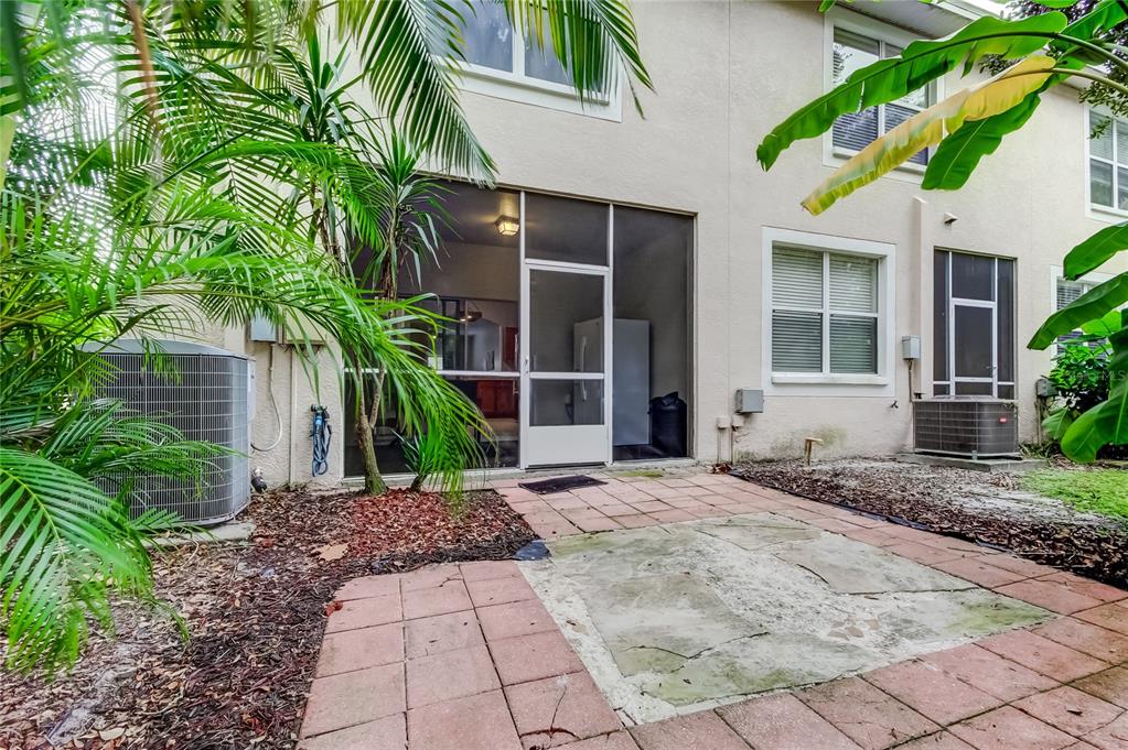 1138 Hillhurst Drive Wesley Chapel, FL 33543 - Photo 44 of 65 a front view of a house with garden