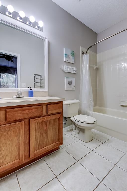 1138 Hillhurst Drive Wesley Chapel, FL 33543 - Photo 50 of 65 a bathroom with a sink a toilet and shower