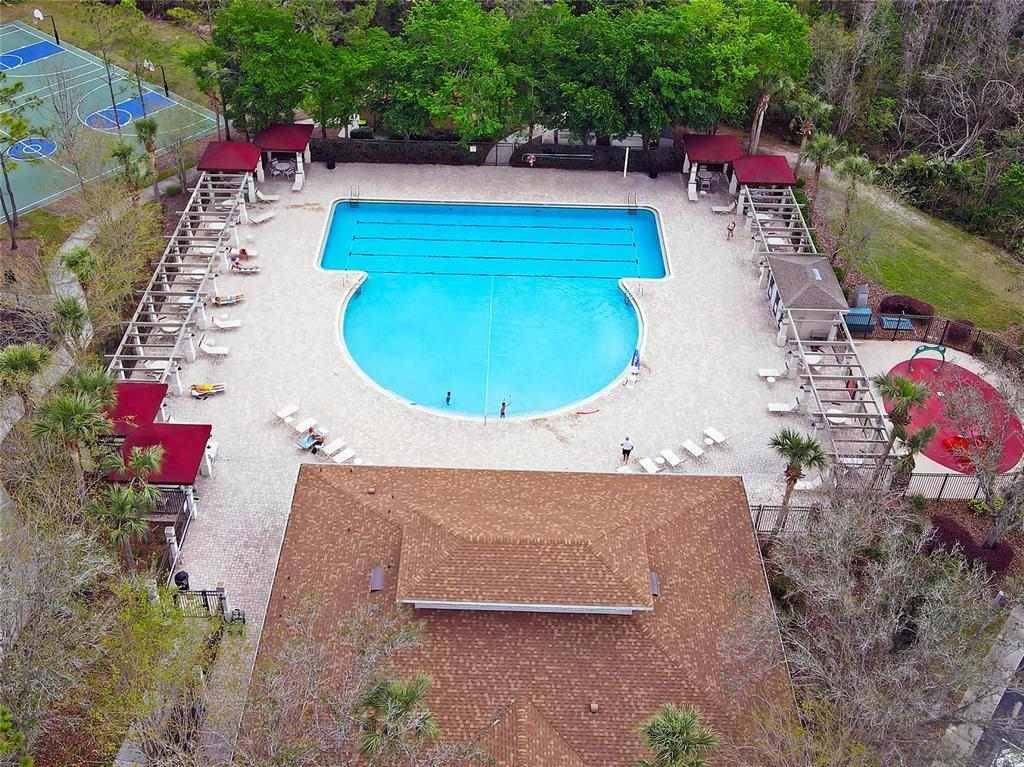 1138 Hillhurst Drive Wesley Chapel, FL 33543 - Photo 52 of 65 an aerial view of a house with a swimming pool patio and outdoor seating