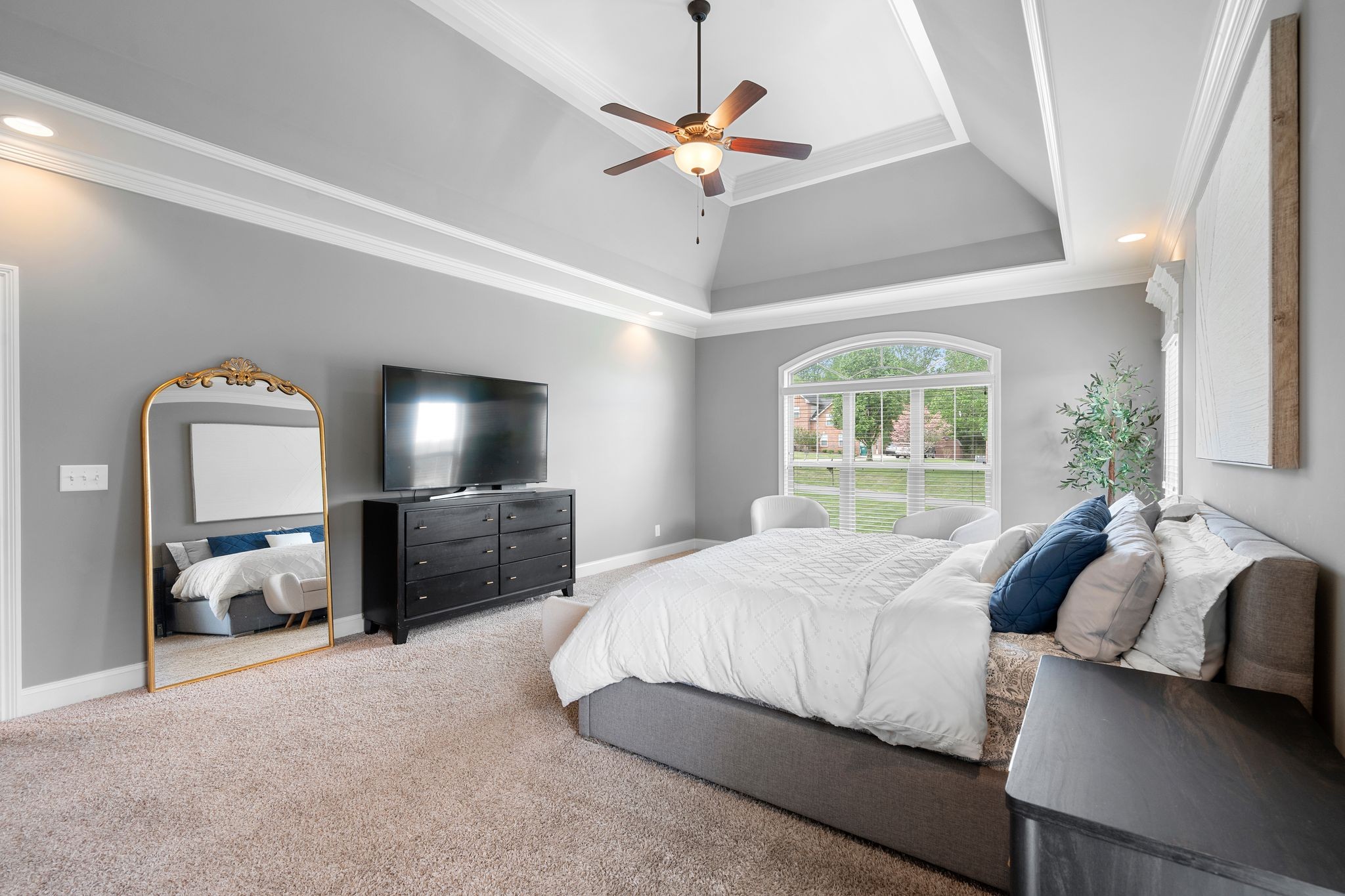 1013 Mires Road Mount Juliet, TN 37122 - Photo 21 of 50 a bedroom with a bed flat screen tv and a large window