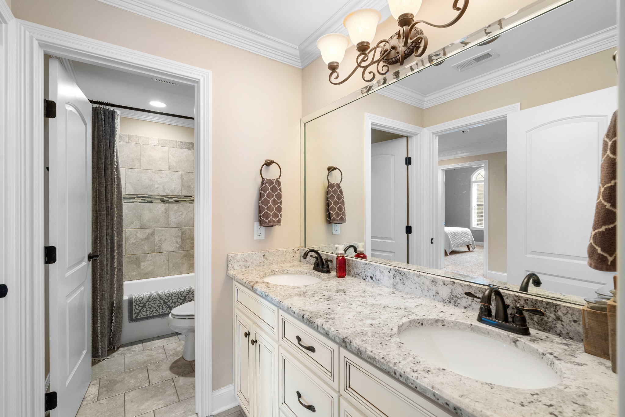1013 Mires Road Mount Juliet, TN 37122 - Photo 33 of 50 a bathroom with a granite countertop sink a mirror and a shower