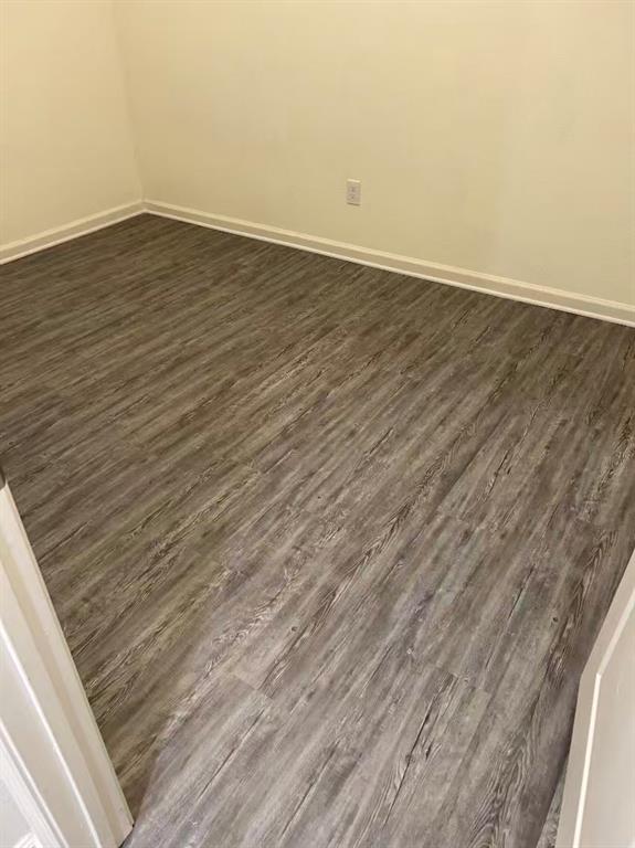 6228 Old Bridge Way Forney, TX 75126 - Photo 6 of 7 a view of an empty room with wooden floor