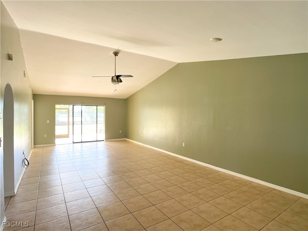 1156 Southwest 47th Terrace Cape Coral, FL 33914 - Photo 3 of 13 an empty room with windows