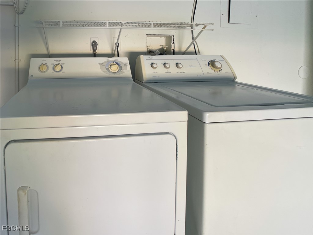 1156 Southwest 47th Terrace Cape Coral, FL 33914 - Photo 8 of 13 a utility room with dryer and washer