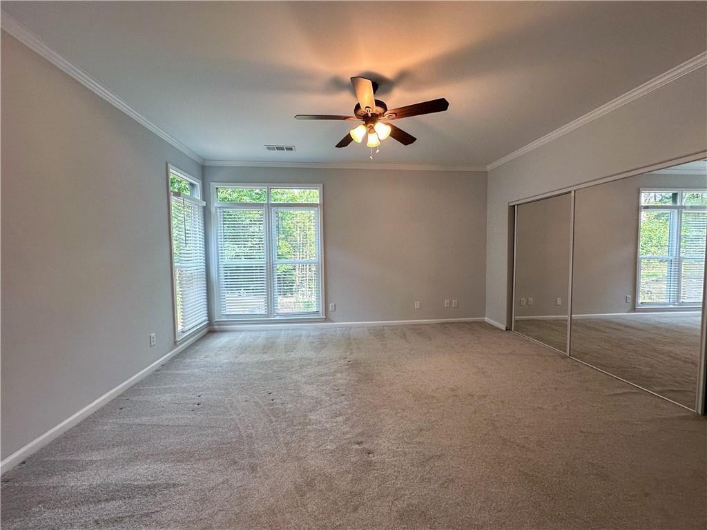 3255 Park Chase Alpharetta, GA 30022 - Photo 12 of 27 a view of a livingroom with a ceiling fan and window