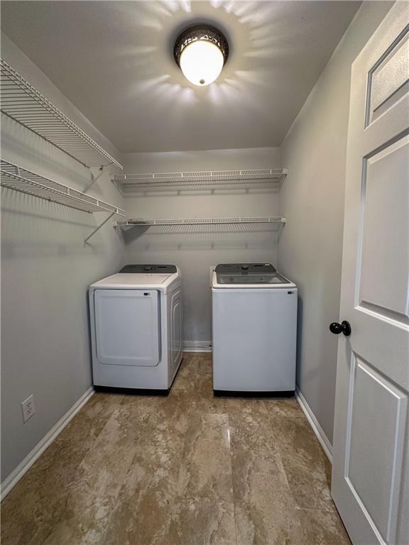 3255 Park Chase Alpharetta, GA 30022 - Photo 25 of 27 a view of storage and utility room with washer and dryer