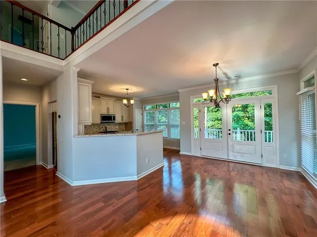 a view of a living room and hardwood floor