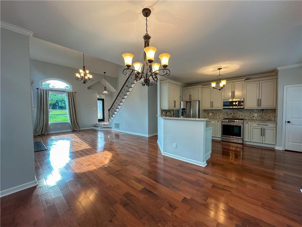 3255 Park Chase Alpharetta, GA 30022 - Photo 7 of 27 a view of a kitchen and chandelier