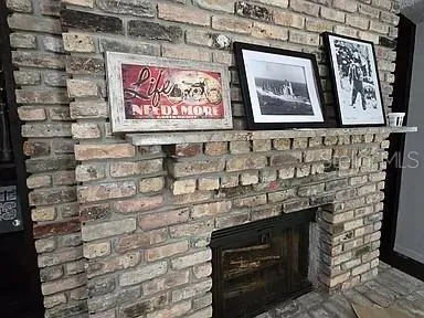 a sign on the brick wall