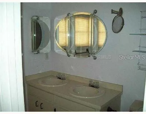 a bathroom with a sink and mirror