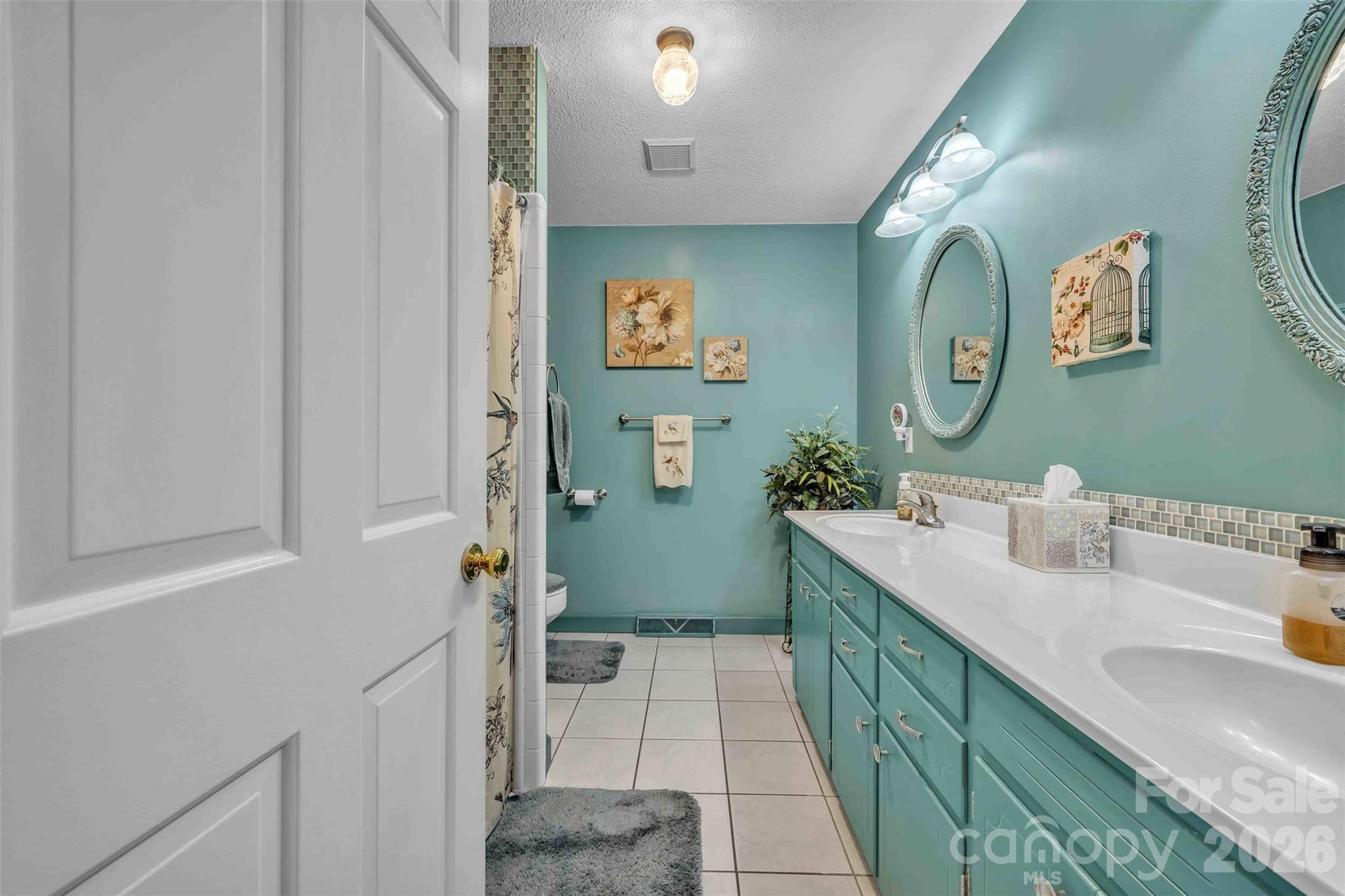 137 Proust Road Statesville, NC 28625 - Photo 21 of 47 a bathroom with a double vanity sink mirror and toilet