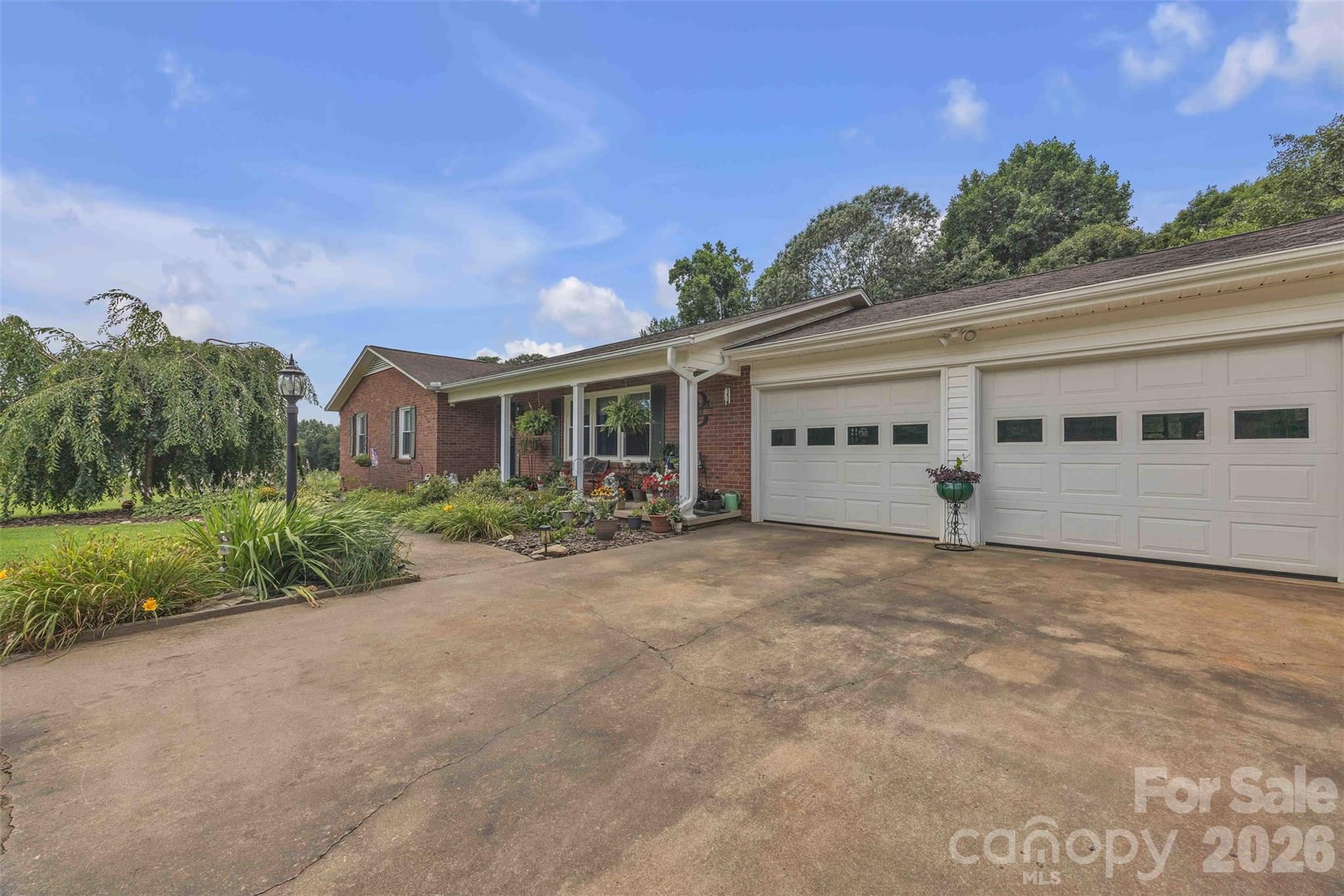 137 Proust Road Statesville, NC 28625 - Photo 4 of 47 front view of a house with a plants and trees