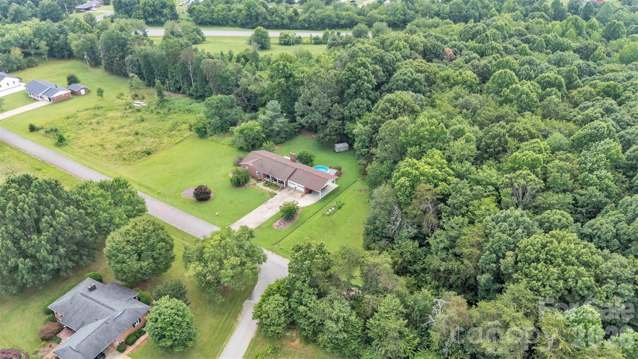 137 Proust Road Statesville, NC 28625 - Photo 42 of 47 an aerial view of a residential houses with outdoor space and street view