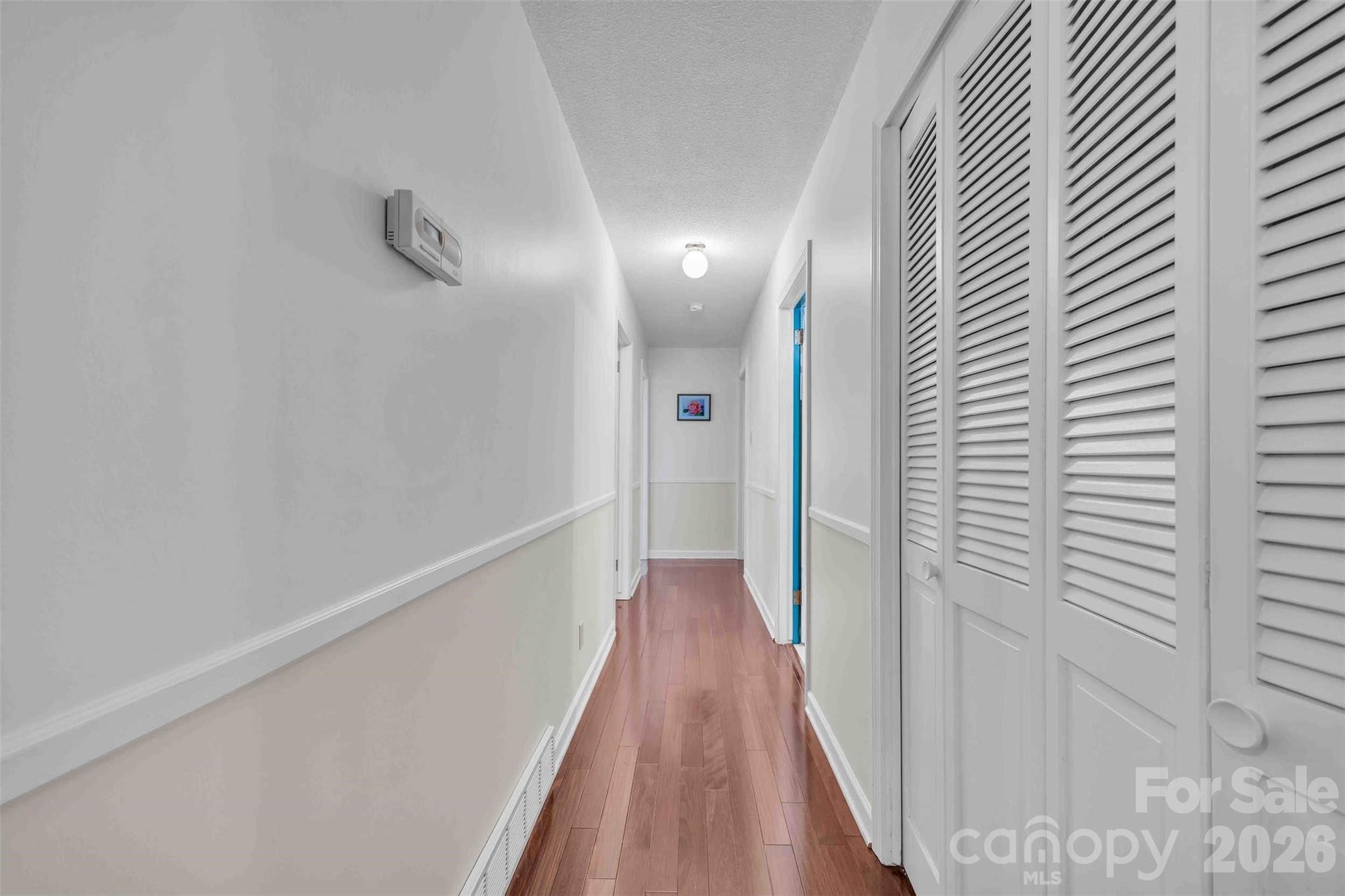 137 Proust Road Statesville, NC 28625 - Photo 6 of 47 a view of a hallway with wooden floor