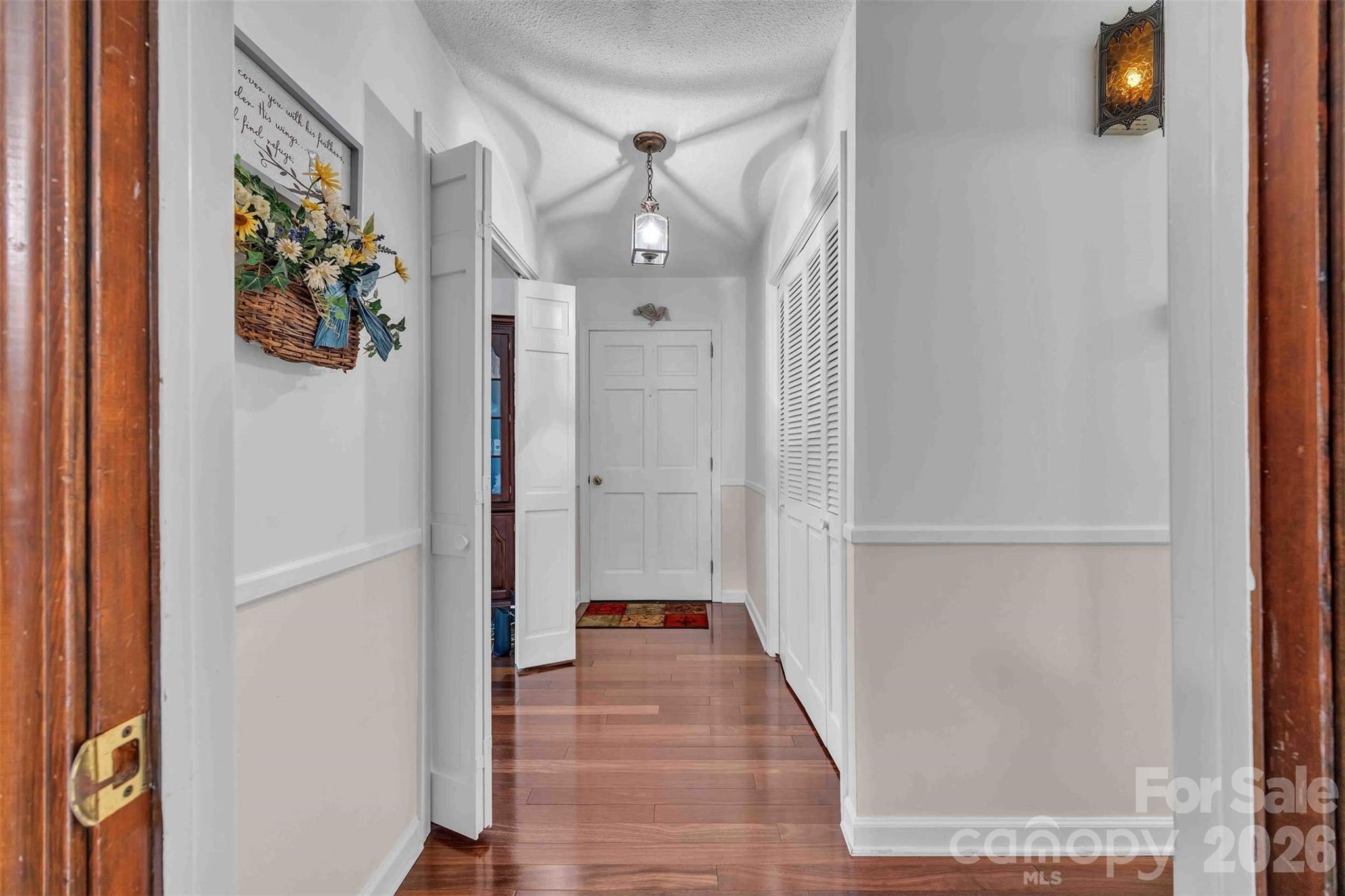 137 Proust Road Statesville, NC 28625 - Photo 7 of 47 a view of a hallway with wooden floor and staircase
