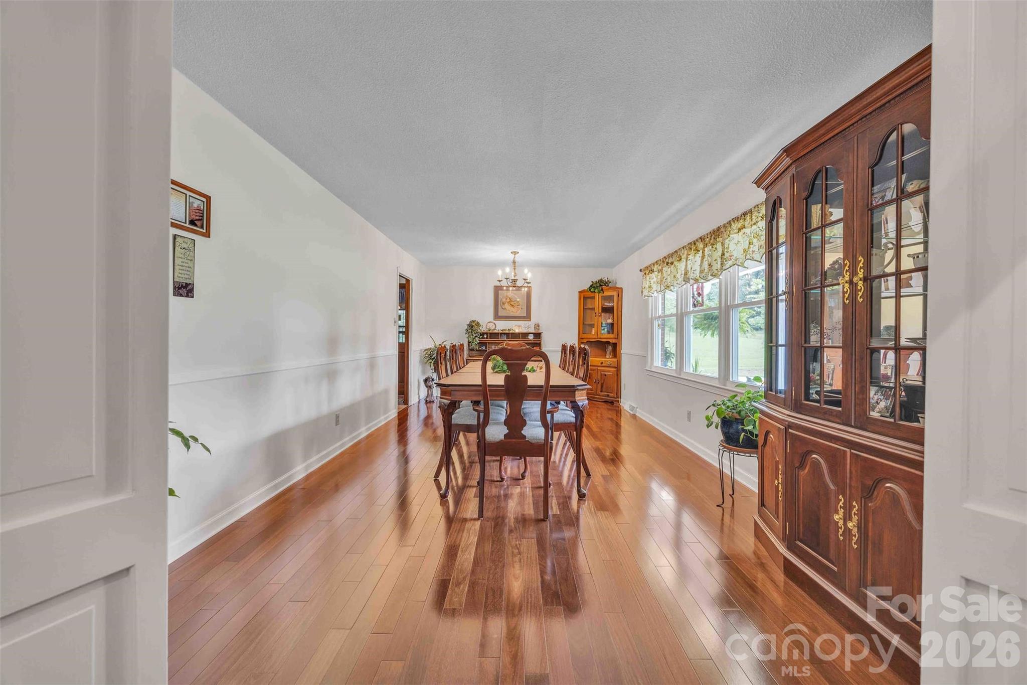 137 Proust Road Statesville, NC 28625 - Photo 8 of 47 a dining room with furniture and wooden floor