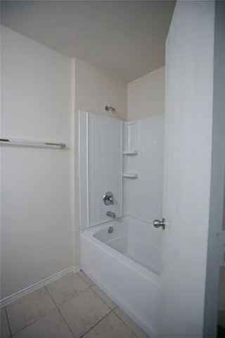 a white bath tub sitting in a bathroom