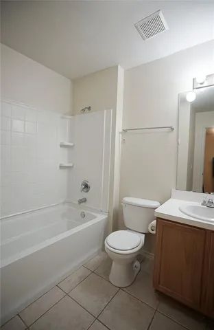a bathroom with a toilet a sink and bathtub