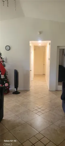 a view of an empty room and a window