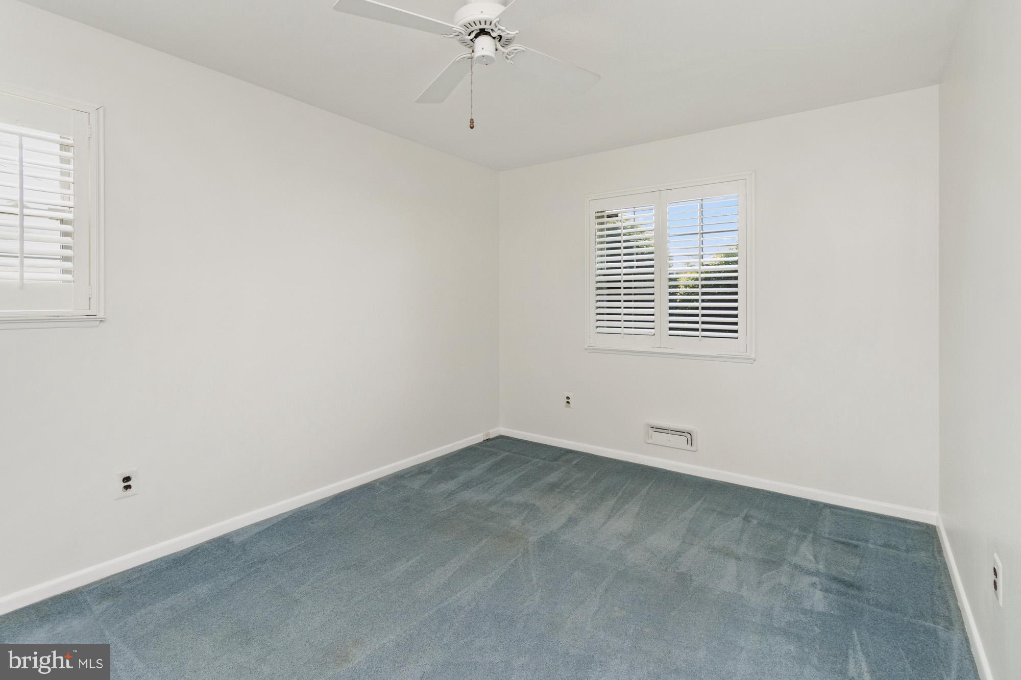 1429 Adamsview Road Baltimore, MD 21228 - Photo 19 of 44 a view of an empty room with a window