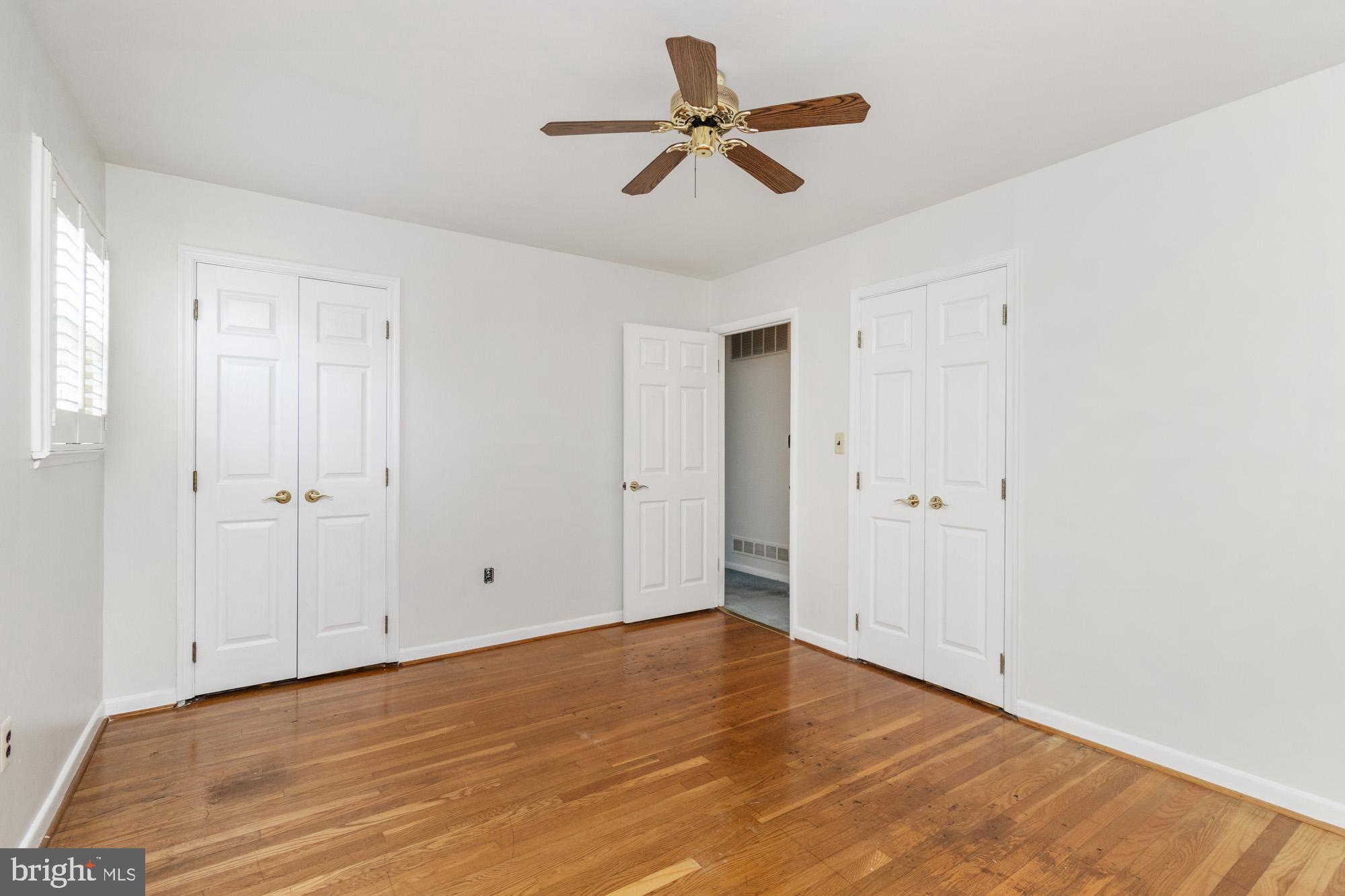 1429 Adamsview Road Baltimore, MD 21228 - Photo 23 of 44 a view of empty room with wooden floor
