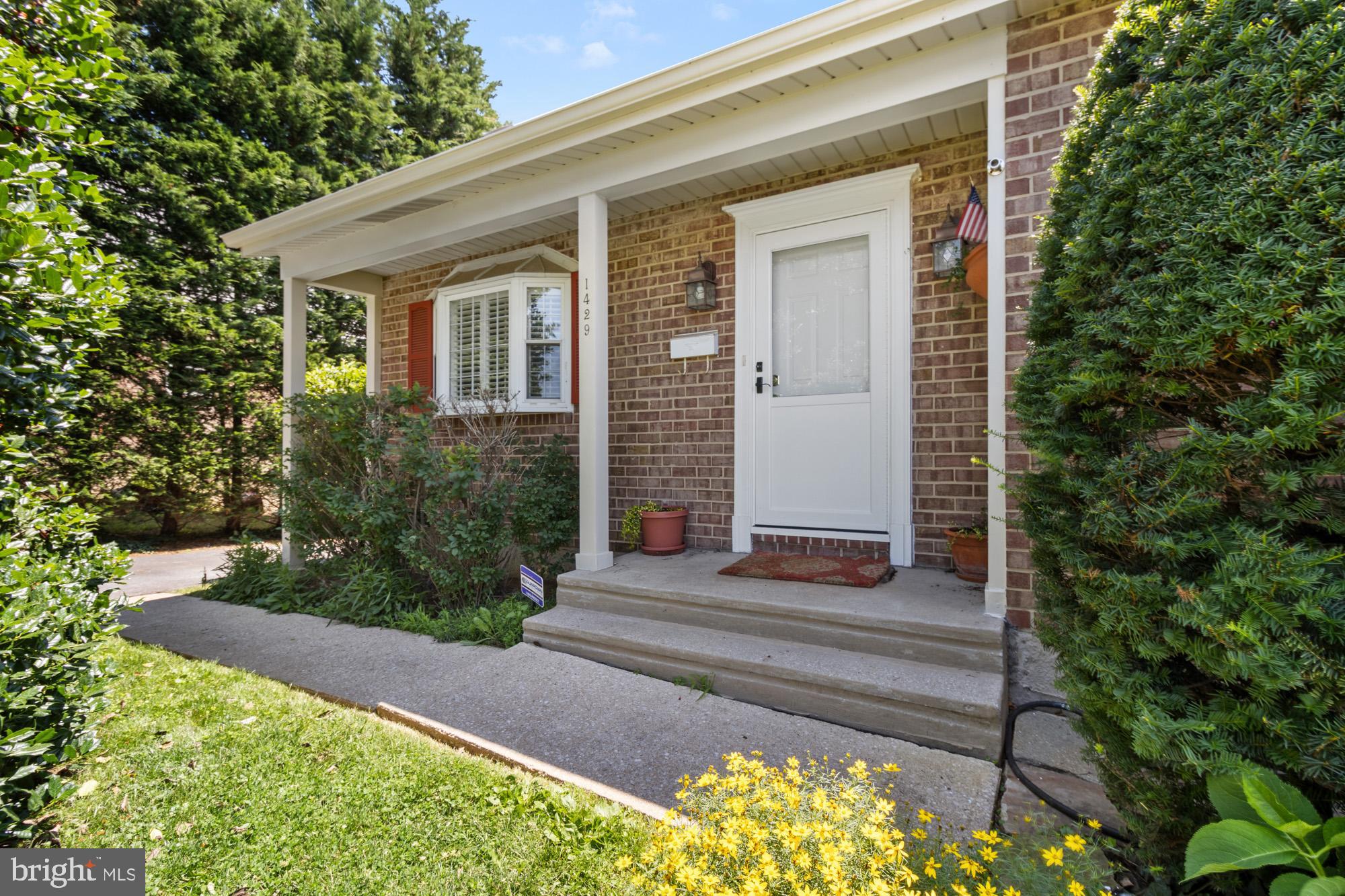 1429 Adamsview Road Baltimore, MD 21228 - Photo 31 of 44 a front view of a house with garden
