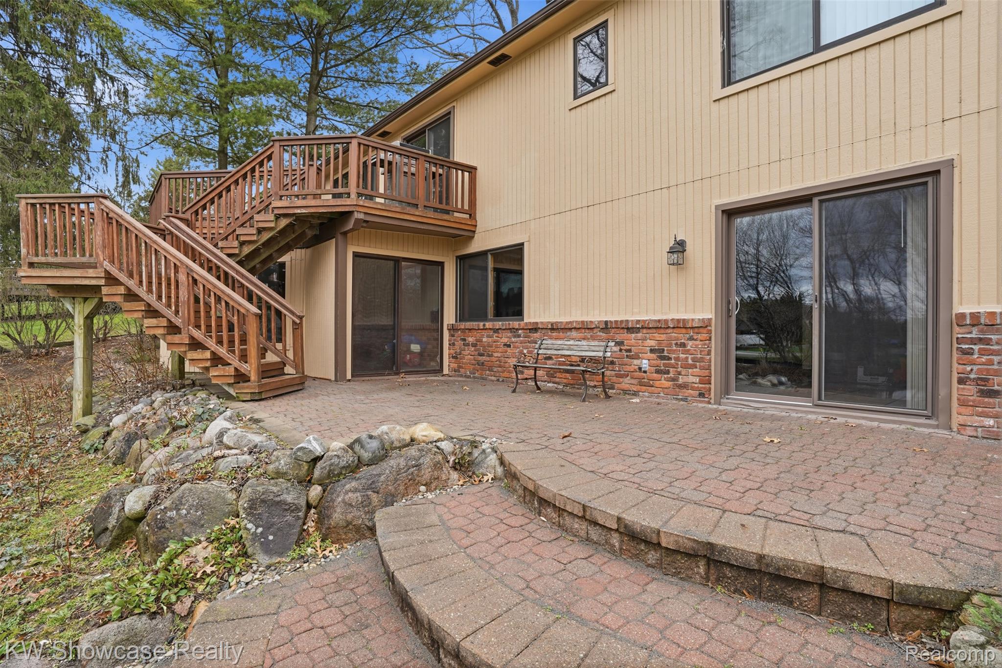 3330 Benstein Road Commerce Township, MI 48382 - Photo 22 of 40 Paver patio from walkout and sunroom w/ hot tub