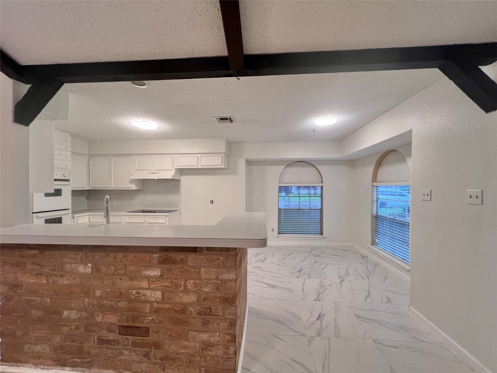 23111 Bayleaf Drive Spring, TX 77373 - Photo 2 of 28 a large kitchen with kitchen island a sink stainless steel appliances and cabinets