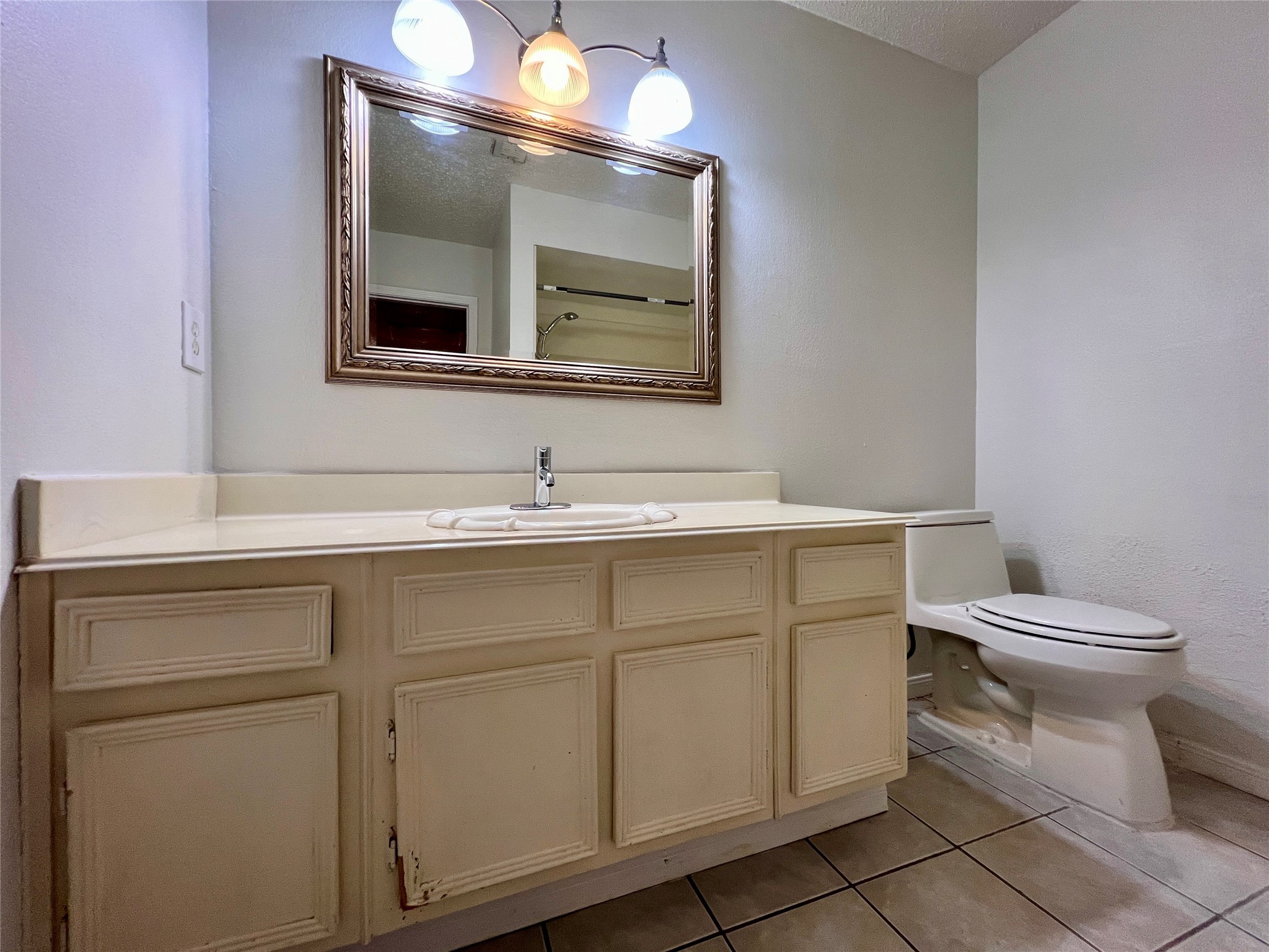 23111 Bayleaf Drive Spring, TX 77373 - Photo 21 of 28 a bathroom with a toilet sink and mirror